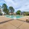a swimming pool surrounded by sun beds