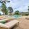 a swimming pool surrounded by sun beds