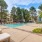 a swimming pool surrounded by sun beds
