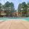 a swimming pool surrounded by sun beds
