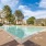 a swimming pool surrounded by trees